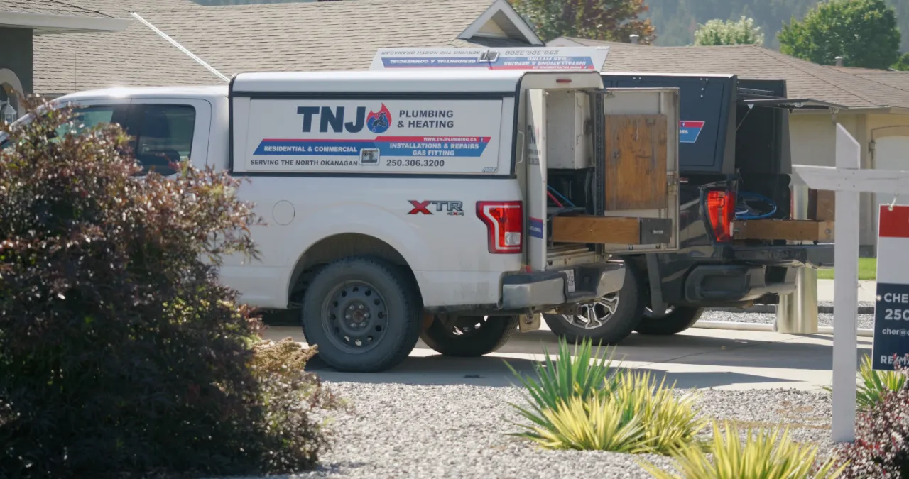 Professional plumber installing heating system in house